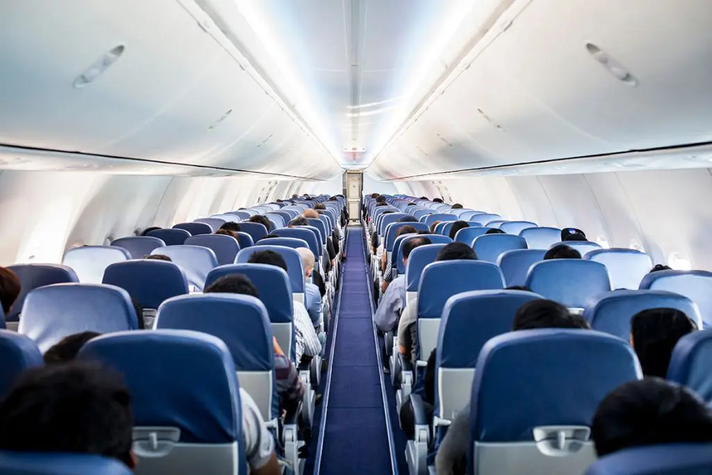 Blue chairs inside a passenger plane